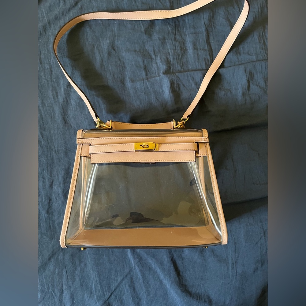 Clear bag with baby pink detailing; unsure of the brand-looks like a Kelly bag